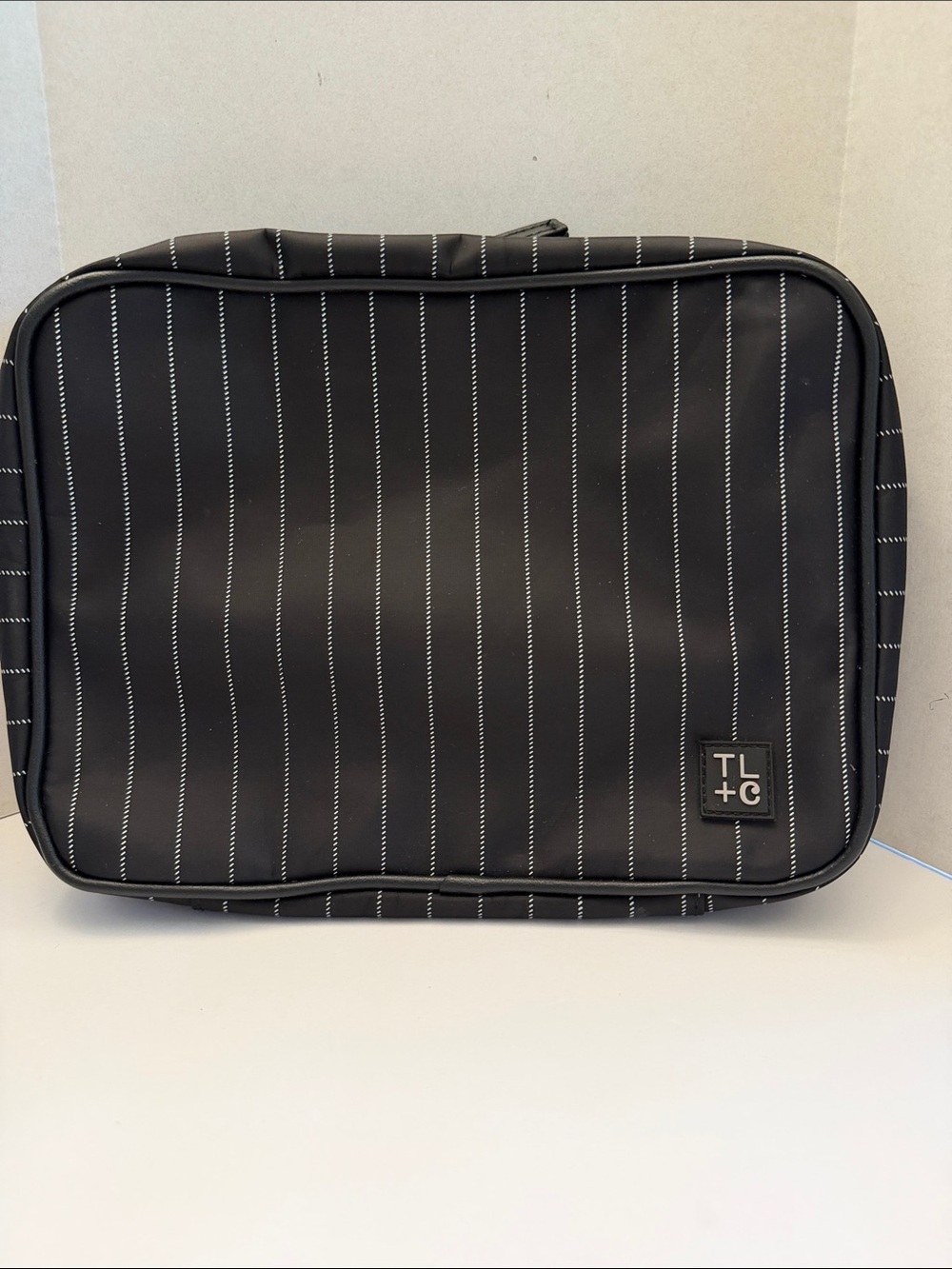 Tender Love and Carry Black Pinstriped Toiletry Bag